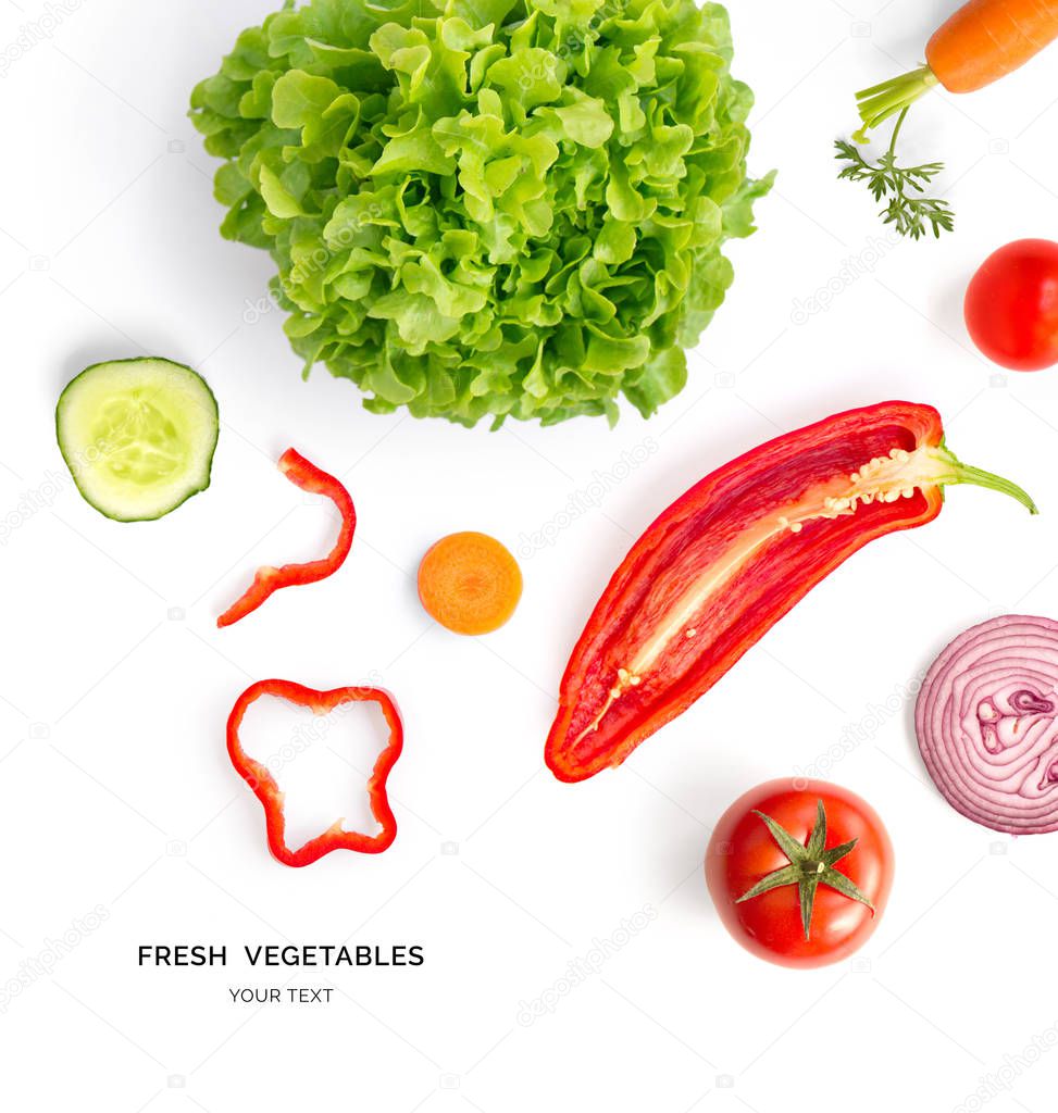 Creative layout made of tomato, onion, red peppers, cucumber and lettuce on white background 