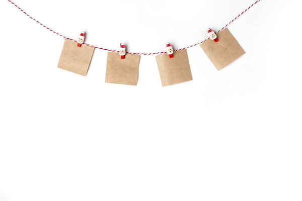 Blank notes craft on clothespins, Top view White Background Christmas New Year