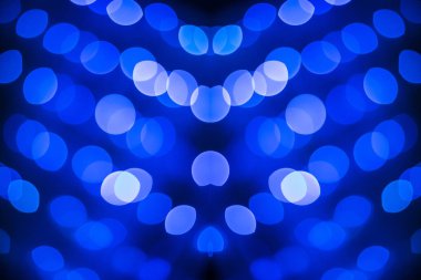 Soyut simetrik glitter mavi ışıklar bokeh doku siyah arka plan üzerine defocused 