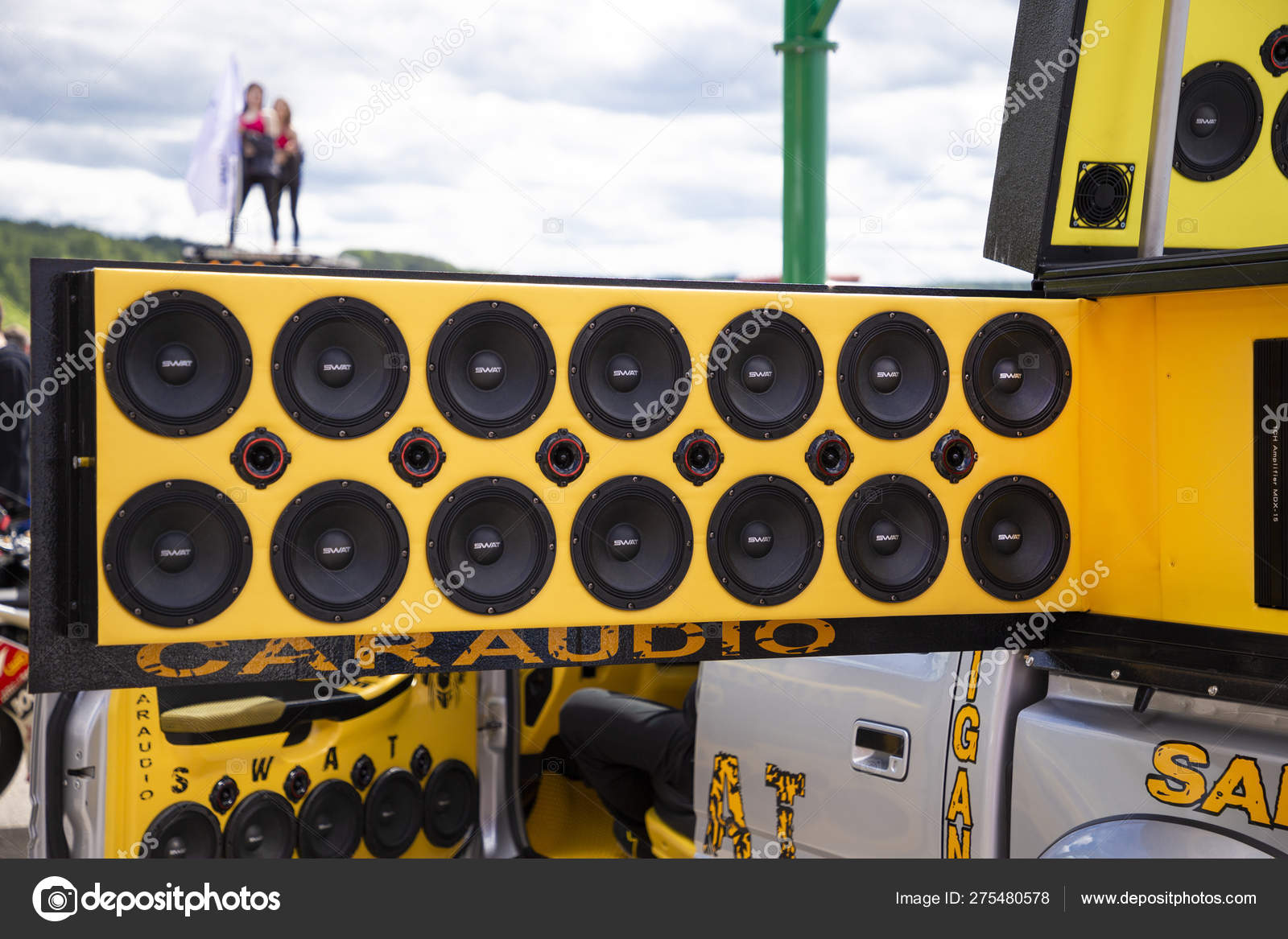 Tuning modern car with extreme powerful audio system. Subwoofer bass tuning. Tuning show in