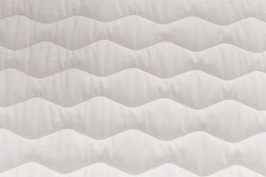 Yatak dokusunu kapatın. Rahat uyku konsepti. Yeni modern yatak, arka plan için. .