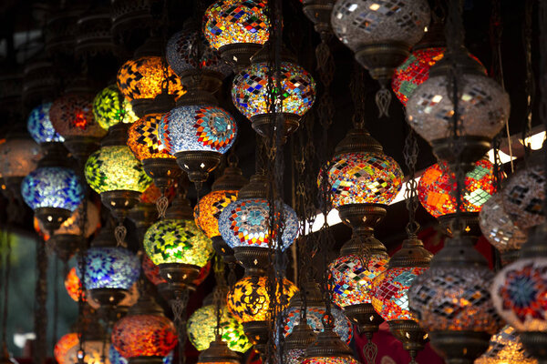 Shop with traditional mosaic multi colored turkish lamps or lanterns. Popular souvenir from Turkey. Istanbul, Turkey, 2019-08-10