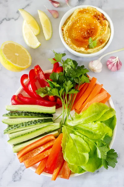 Hummus Different Vegetables Lettuce Leaves Lemon Garlic Light Background Vegan — Stock Photo, Image