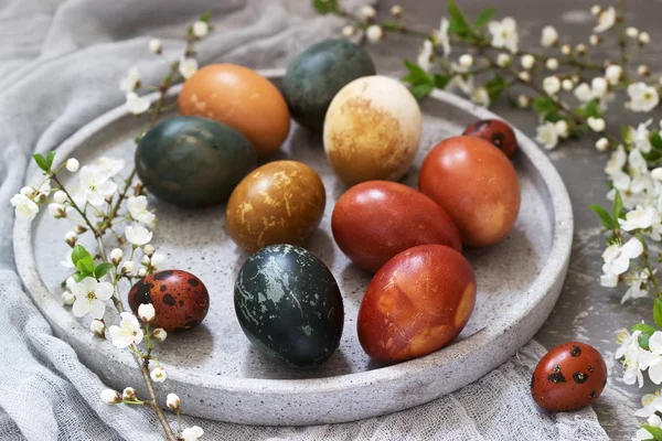 Easter eggs dyed with natural dyes, cabbage, chamomile, hibiscus and onion peel.