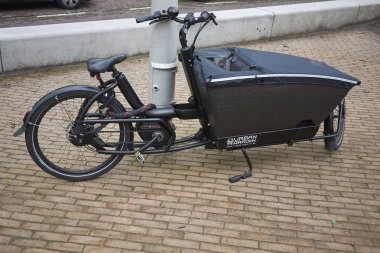 Amsterdam, Netherlands - February 22, 2019: Cargo bike clipart