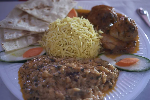 Indian meal with basamati rice, daal and chicken curry