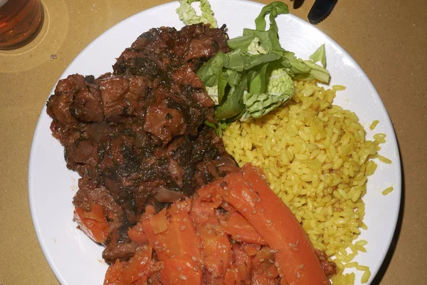 Assorted Vegan plate with rice, carrots and seitan