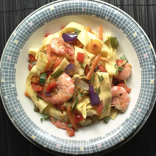 Tagliatelle pasta with shrimps and vegetables