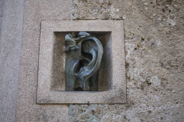 Milano, Italy - September 26, 2018 : Adolfo Wildt sculpture as an intercom clipart