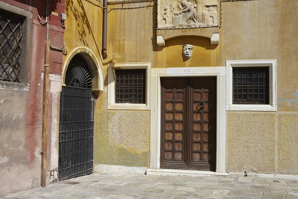 Venezia, Italy - September 08, 2015 : Door enrance of an ancient building in Venice