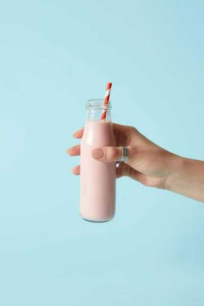 Cropped Image Woman Holding Strawberry Milkshake Bottle Drinking Straw Blue — Stock Photo, Image