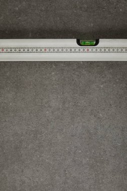 view from above of spirit level on gray surface clipart