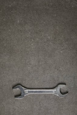 elevated view of spanner on gray surface  clipart
