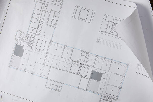 view from above of architectural blueprint on white paper 