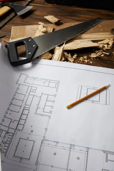 Closeup View Architectural Blueprint Pencil Handsaw Axe Coping Saw Wooden — Stock Photo, Image