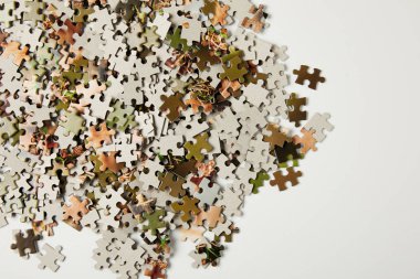 top view of jigsaw puzzle pieces with copy space on grey   clipart