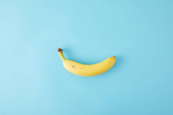 top view of fresh banana isolated on blue