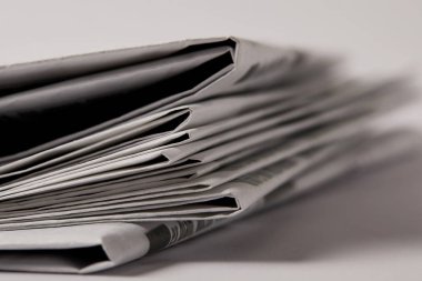 close up of pile of newspapers, selective focus on white clipart