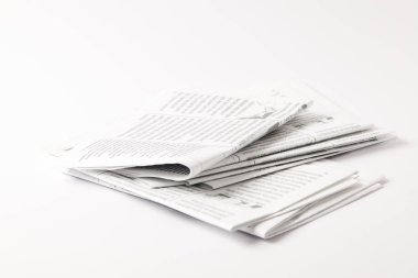 heap of black and white newspapers, isolated on white clipart