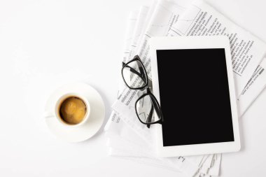 top view of glasses, cup of coffee, digital tablet and pile of newspapers, on white clipart