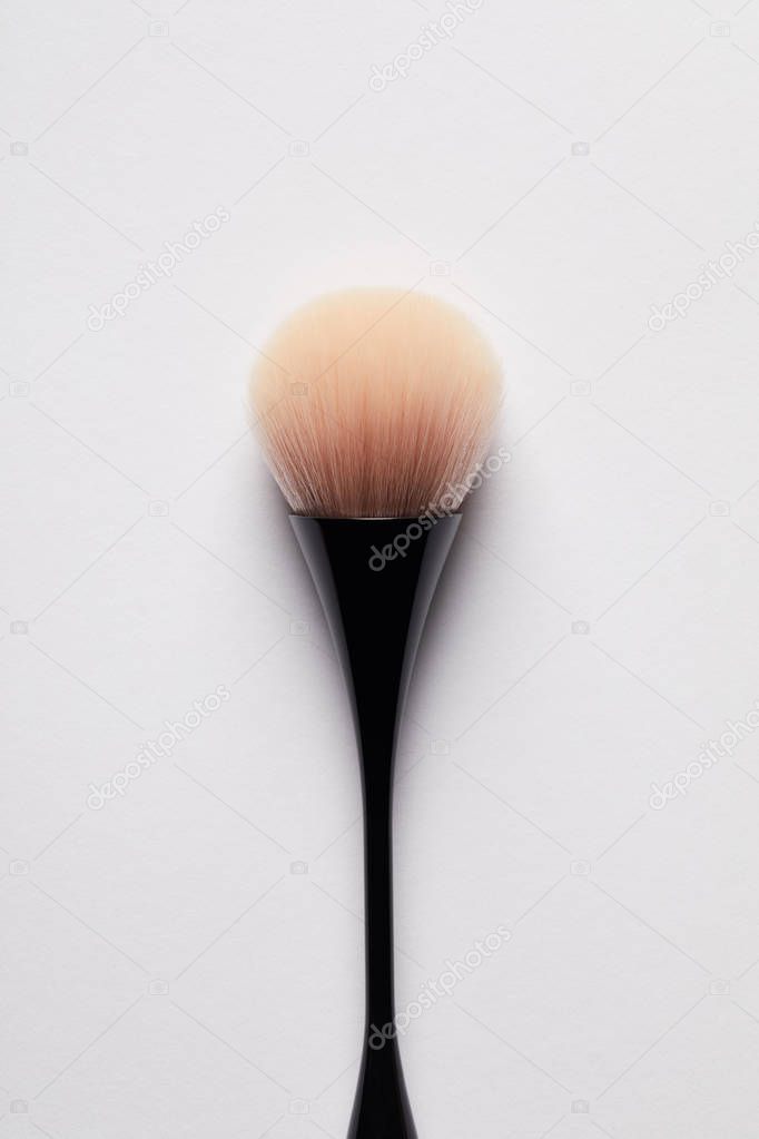 close-up view of single professional brush for permanent makeup isolated on white