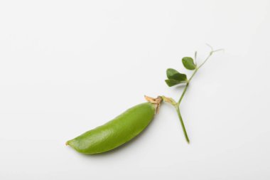 top view of green pea pod on white surface clipart