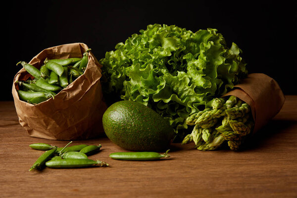 close-up shot of healthy green vegetables on wooden surface