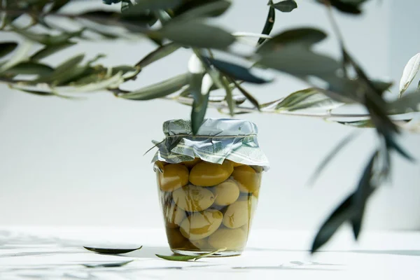 Jar Aromatic Oil Green Olives Branches White Table — Stock Photo, Image