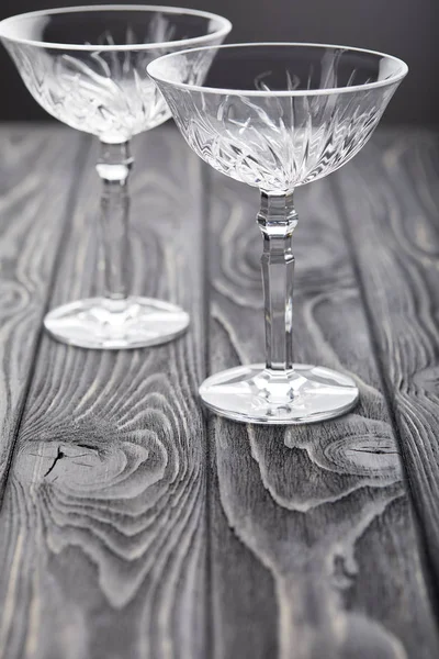 Two Empty Glasses Grey Wooden Tabletop — Free Stock Photo