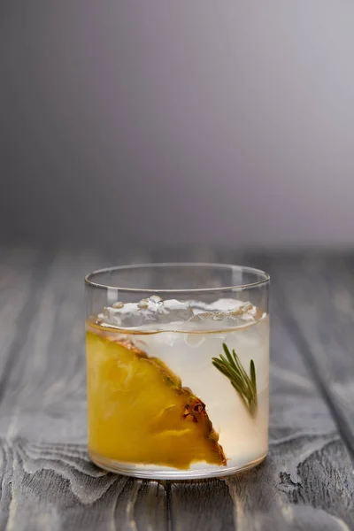 Glass Lemonade Rosemary Ice Cubes Pineapple Grey Wooden Table — Stock Photo, Image