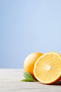 close-up shot of ripe oranges on wooden surface clipart