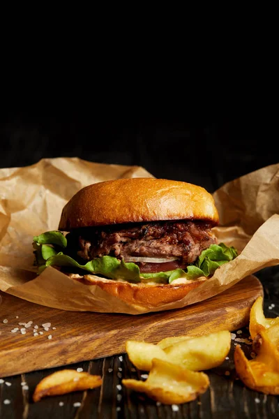 Tempting fast food diner with burger and golden fried poatato