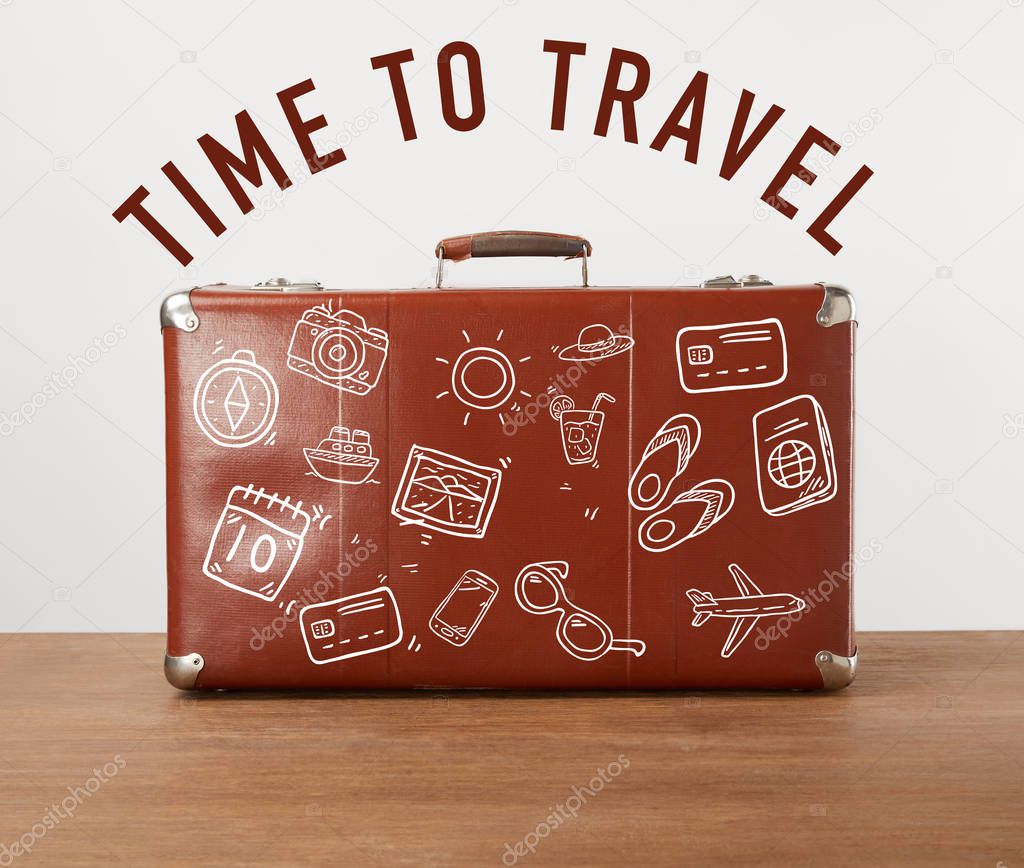Vintage brown leather suitcase with icons and lettering - Time to travel 