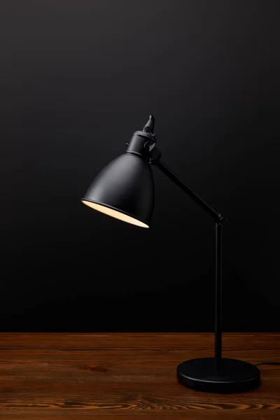 Close View Black Lamp Wooden Tabletop Black Background — Stock Photo, Image