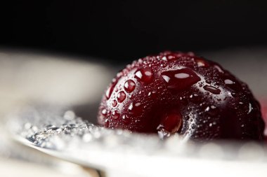 close-up shot of washed ripe cherry covered with water droplets clipart