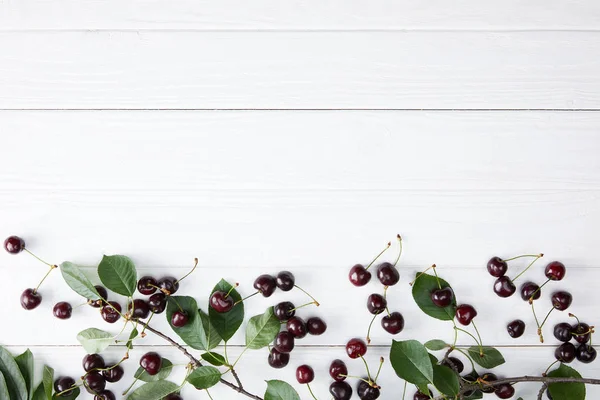 Top View Red Rainier Cherries Spilled White Wooden Surface Leaves — Stock Photo, Image