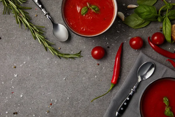 Top view of plates with tasty tomato soup and fresh tomatoes on grey table — Stock Image Top View Plates Tasty Tomato Soup Fresh Tomatoes Grey Table Stock Photo