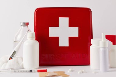 close-up shot of first aid kit box with various medical supplies on white clipart