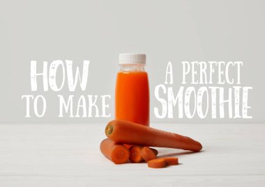 bottle of detox smoothie with carrots on white wooden surface, how to make perfect smoothie inscription clipart