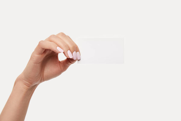 cropped image of businesswoman showing empty business card isolated on white background