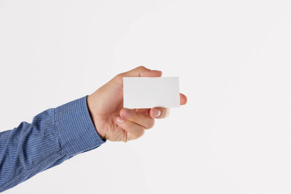 cropped image of businessman showing blank business card isolated on white background 