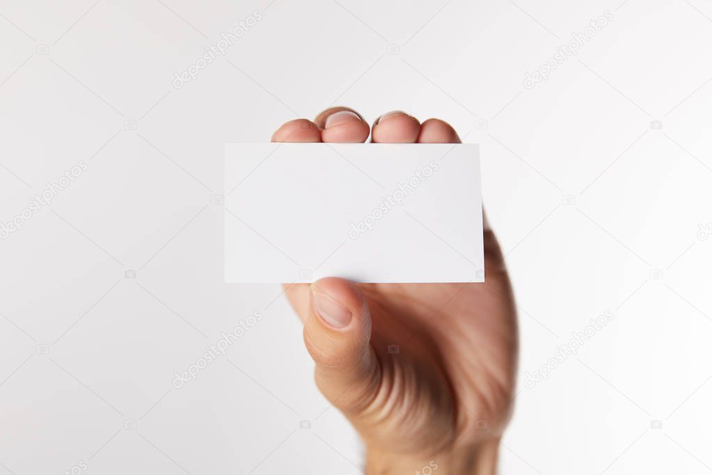 cropped image of businessman showing empty visit card isolated on white background 