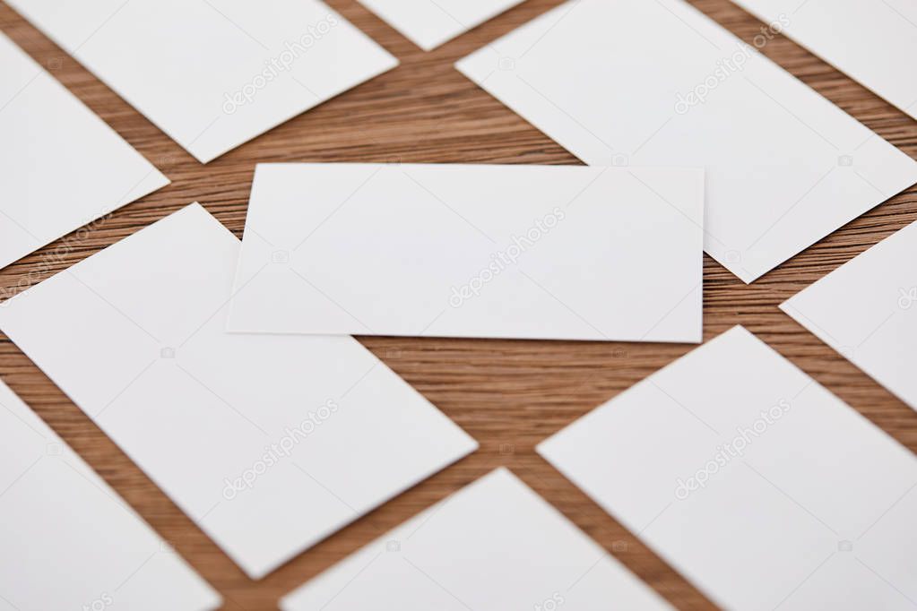 close up view of set of empty business cards at wooden table 