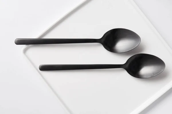 Top View Two Spoons Plate White Table Minimalistic Concept — Stock Photo, Image