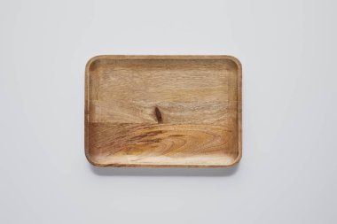 top view of wooden tray on white table, minimalistic concept clipart