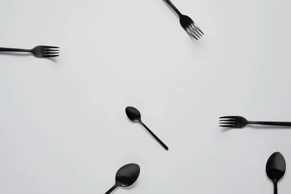 Top View Various Black Spoons Forks White Table — Stock Photo, Image