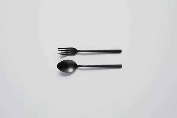 Top View Black Spoon Fork White Table Minimalistic Concept — Stock Photo, Image