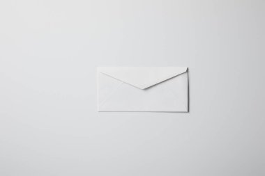 top view of blank envelope on white surface for mockup clipart