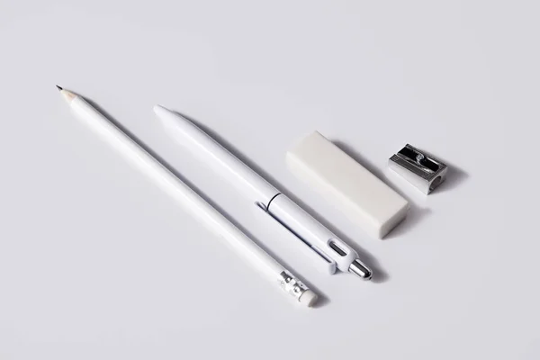 Close Shot Pen Pencil Eraser Sharpener Row White Surface Mockup — Stock Photo, Image