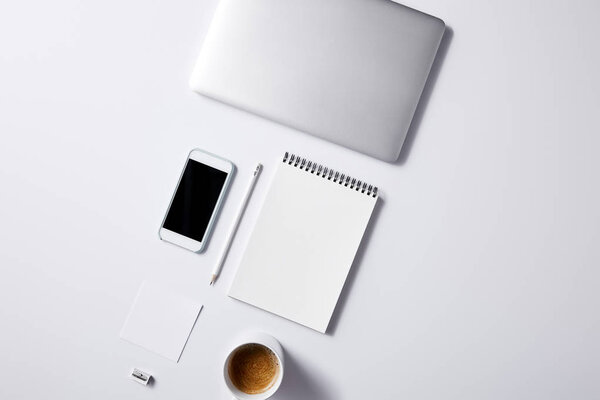 top view of arranged various business workplace objects on white tabletop for mockup